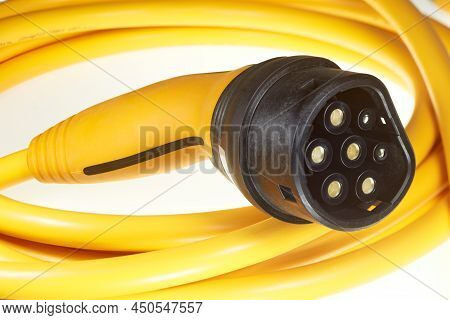 A Colored Charging Cable For Electric Cars Against A White Background.