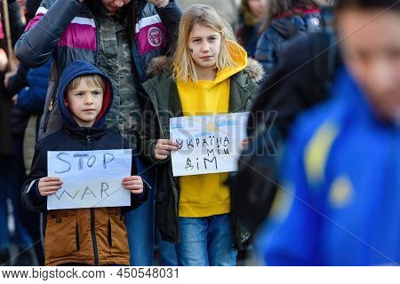 Strasbourg, France - Mar 6, 2022: Sister And Brother Holding Placards Stop War In Front Of Russian C