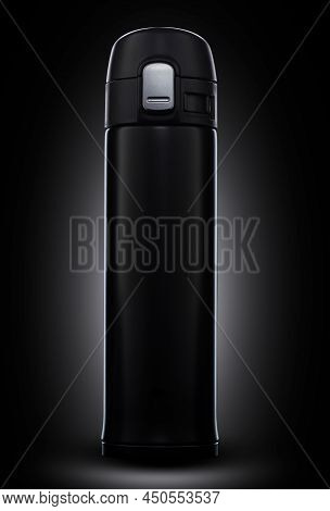 Black Thermos On A Black Background. Black Mug On A Black Background. Thermos For Storing Hot Drinks