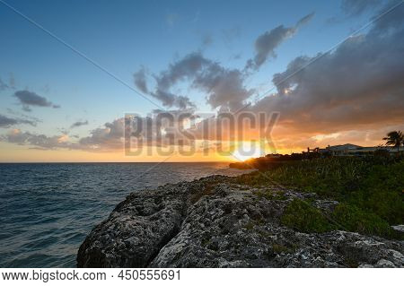 Amazing Sunset On Atlantic Ocean Shore. Rocky Bay In Aquatic Sundown. Unreal Marine Afterglow On Car