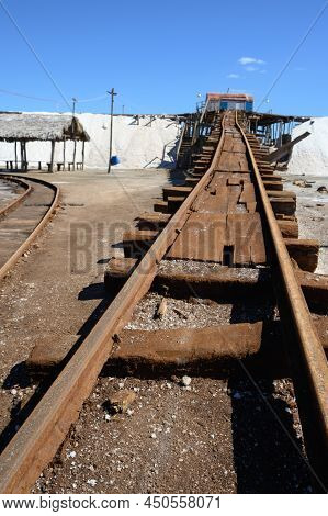 Ocean Sal Industry In Caribbean Island Dominican Republic. Old Rails Serve For Transportation Salt F