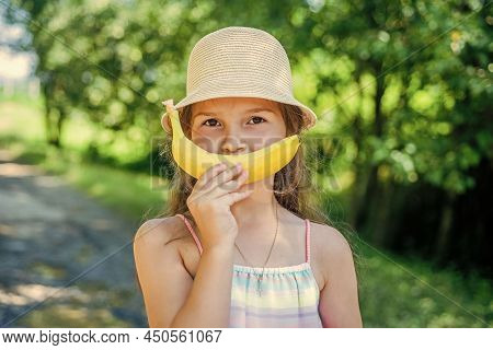 Banana Smile. Funny Baby On Natural Landscape. Teeth Health. Tooth Filling. Dental Care. Oral Hygien