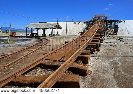 Marine Salt Industry In Caribbean Island Dominican Republic. Old Rails Serve For Transportation Salt