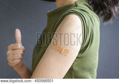 Close Up View Of Woman Arm With Bandage, Getting Vaccinated Immunity. Inoculation, Vaccination, Vacc