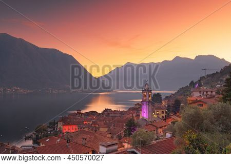 Sala Comacina, Como, Italy small town on Lake Como at dusk.