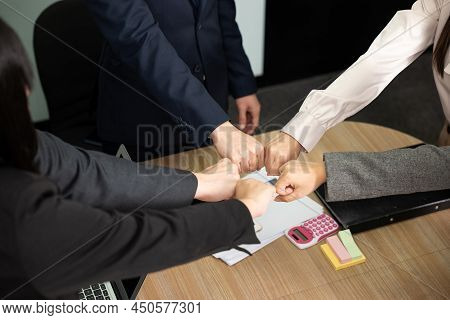 Business People Join Punching Fists Bump Hands As Team Their Meeting, Giving Touch Punch Together Of