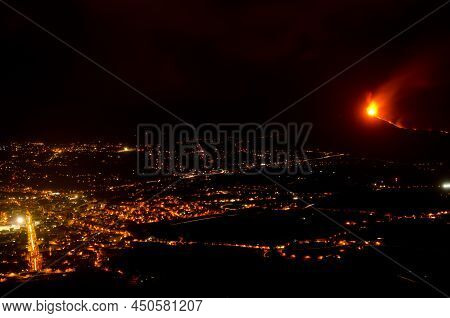 Volcanic Eruption Of Cumbre Vieja Next To The Village Of Los Llanos De Aridane At Night. La Palma. C