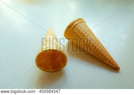 Empty Cripsy Wafers For Ice Cream On A White Countertop