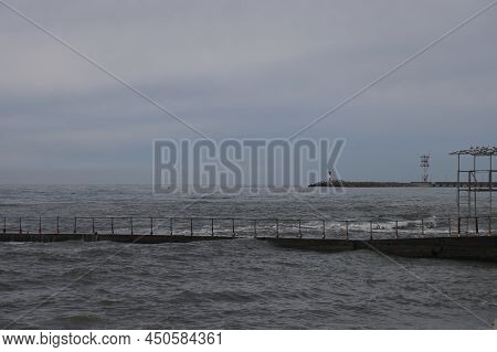 Sochi, Russia 05.07.2021. Breakwater Pier Summer Black Sea Cloudy.