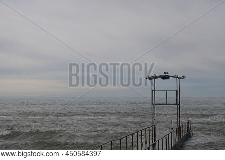 Sochi, Russia 05.07.2021. Breakwater Pier Summer Black Sea Cloudy.