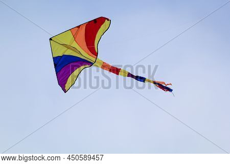 A Colorful Stunt Kite, Kite With Colorful Tail In The Sky.