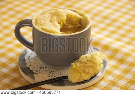 Cake In A Mug. Vanilla Dessert Cooked In The Microwave. Cake Mug.