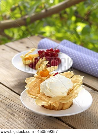 Vanilla And Mastic Scented Ice Cream In A Phyllo Cup(greek Recipe Called Ntontourmas) Decorated With