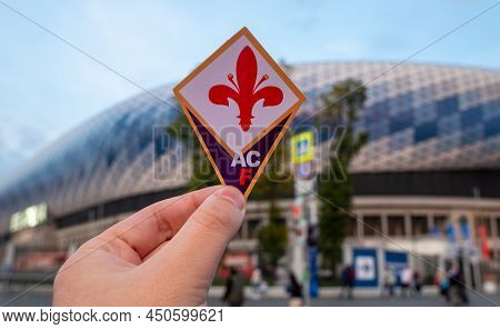 September 12, 2021, Florence, Italy. The Emblem Of The Football Club Acf Fiorentina Against The Back