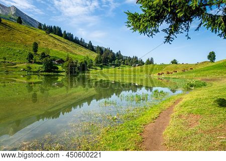 Lake Of The Confins And Mountain Landscape In La Clusaz, Haute-savoie, France