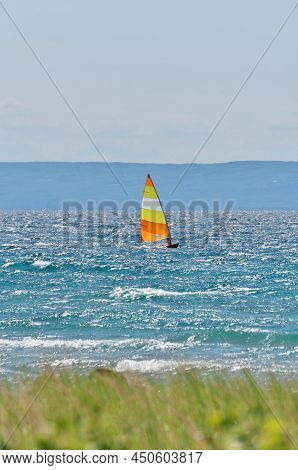 Colorful Sailboat Sailing On A Windy Sunny Summer Day On Georgian Bay