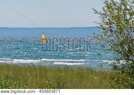 Colorful Sailboat Sailing On A Windy Sunny Summer Day On Georgian Bay