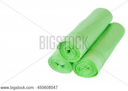 Green Rolls Of Garbage Bin Bags Isolated On White Background With Copy Space