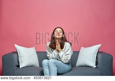 Young Girl Folded Hands Begging, Asking Help, Support, Apologizing, Sitting On Sofa, Praying For Her