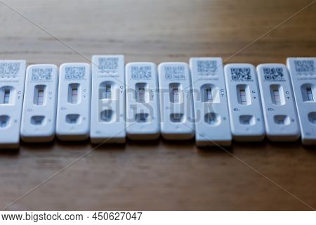 Row Of Positive Covid-19 Rapid Home Lateral Flow Antigen Tests