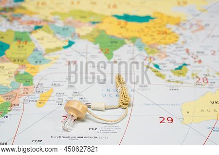 Hoogkerk, Netherlands, November 10 2021: A Crystal Glass Earphone, With Cord, Beige Color. With Plug