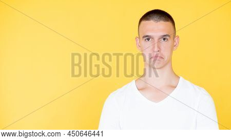 Disappointment Regret. Unhappy Man. Displeased Situation. Upset Sorrowful Guy In White T-hirt With L