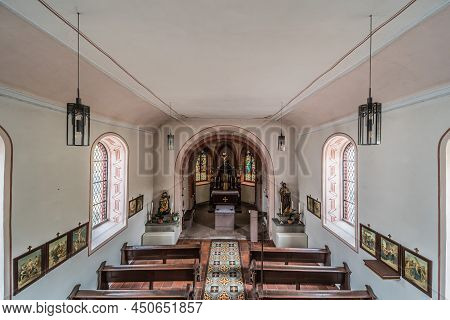 Schweich, Rhineland- Palatinate - Germany  - 04 12 2019 - Small Catholic Church With Wooden Decorati