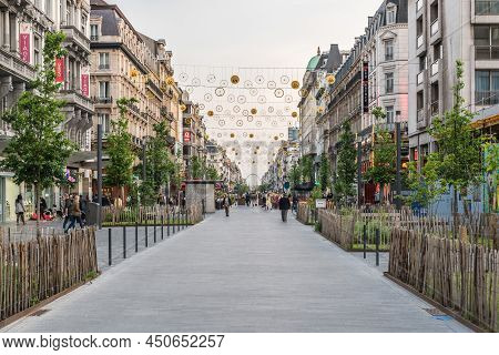 Brussels Old Town - Belgium - 05 22 2019 - Mixed Groups Of People Walking Over The Anspach Boulevard