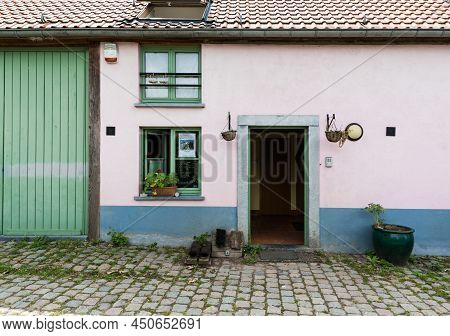 Uccle, Brussels - Belgium - 06 14 2019 - Vintage  Facade Of A Brick Stone Farmers House With A Green