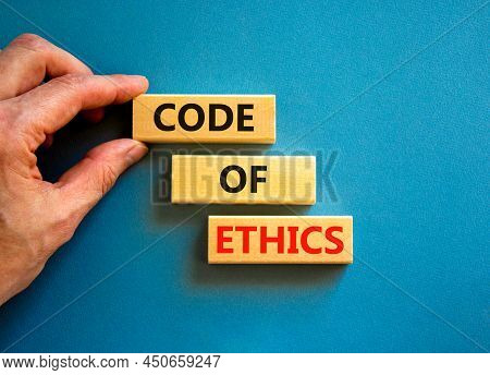Code Of Ethics Symbol. Concept Words Code Of Ethics On Wooden Blocks On A Beautiful Blue Table Blue 