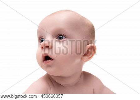 Close-up Portrait Of A Surprised Breastfed Baby On A White Isolated Background