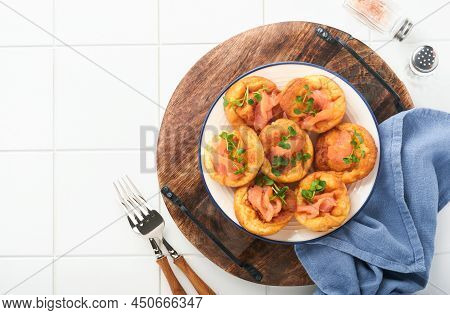 Yorkshire Pudding. Traditional English Yorkshire Pudding With Salmon And Radish Microgreens Side Dis