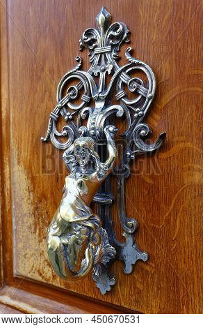 European Vintage Old Metal Wrought Iron Door Knocker. Design Detail. Paris.