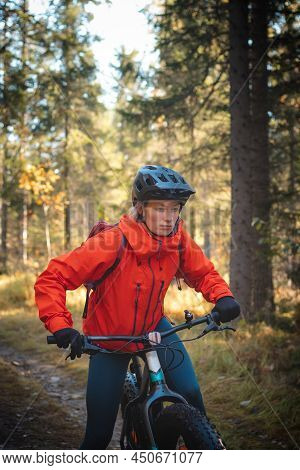 Young Likeable Lady With A Lovely Realistic Smile While Recreationally Sporting. Cyclist Riding Fat 