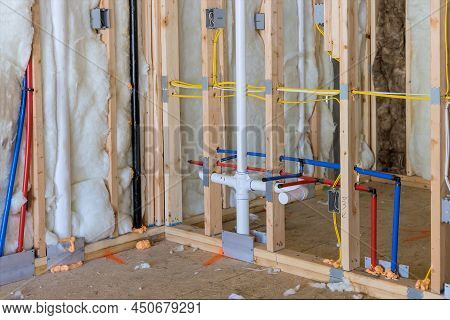 Buildt New Home Construction Featuring Hot And Cold Water Pex Plastic Plumbing Tubes In Bathroom Unf
