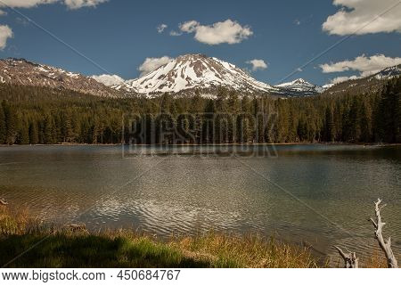 Lassen Peak With Snow Viewed From Manzanita Lake In Lassen Volcanic National Park, California