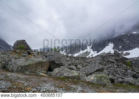 View Of The Area Near The Lake Blavatnet, Rocks, Mountain And Clouds, Lyngen Alps, Norway