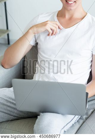 Virtual Meeting. Casual Man. Online Conference. Happy Unrecognizable Guy Sitting Sofa With Laptop Ho