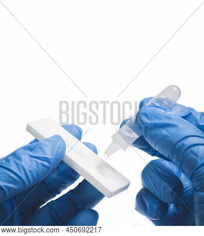 The Doctor Placing The Secretions Sample Into The Sars Cov-2 Rapid Antigen Test Kit (atk) With The E