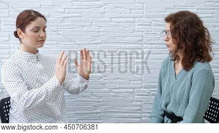 The Psychotherapist Conducts A Hypnosis Session. Female Patient Under Hypnosis.