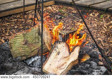 Campfire, Burning Wood At A Tourist Campsite In England