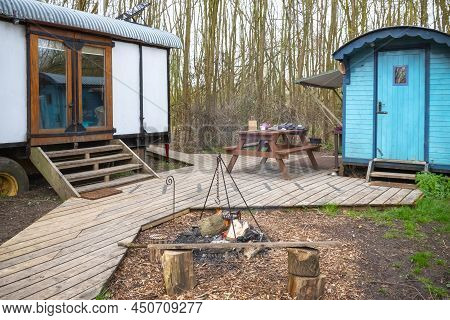 Camping In A Wood With Converted Train Carriages In Gloucestershire, England