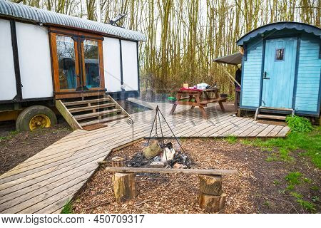 Camping In A Wood With Converted Train Carriages In Gloucestershire, England