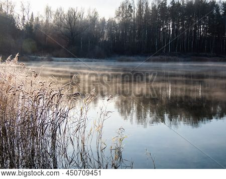 Beautiful Early Winter Morning Scenery Of Landscape Of A Lake With Evaporation Fog In Temperature Be