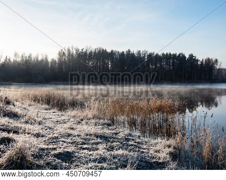 Beautiful Early Winter Morning Scenery Of Landscape Of A Lake With Evaporation Fog In Temperature Be