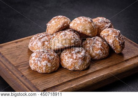 Tasty Homemade Gingerbread Cookies On Dark Concrete Table