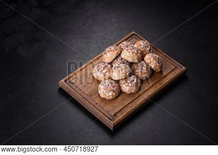 Tasty Homemade Gingerbread Cookies On Dark Concrete Table