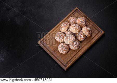 Tasty Homemade Gingerbread Cookies On Dark Concrete Table