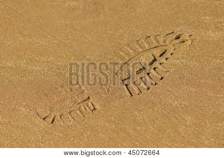 Empreinte de botte sur le sable