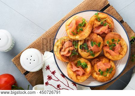 Yorkshire Pudding. Traditional English Yorkshire Pudding With Salmon And Radish Microgreens Side Dis